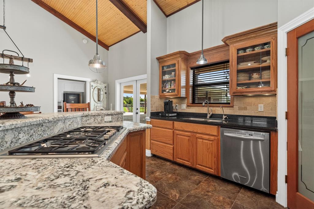 3759 Cr 126 Road Bedias, TX 77831 - Photo 11 of 38 a kitchen with stainless steel appliances granite countertop a stove and a sink