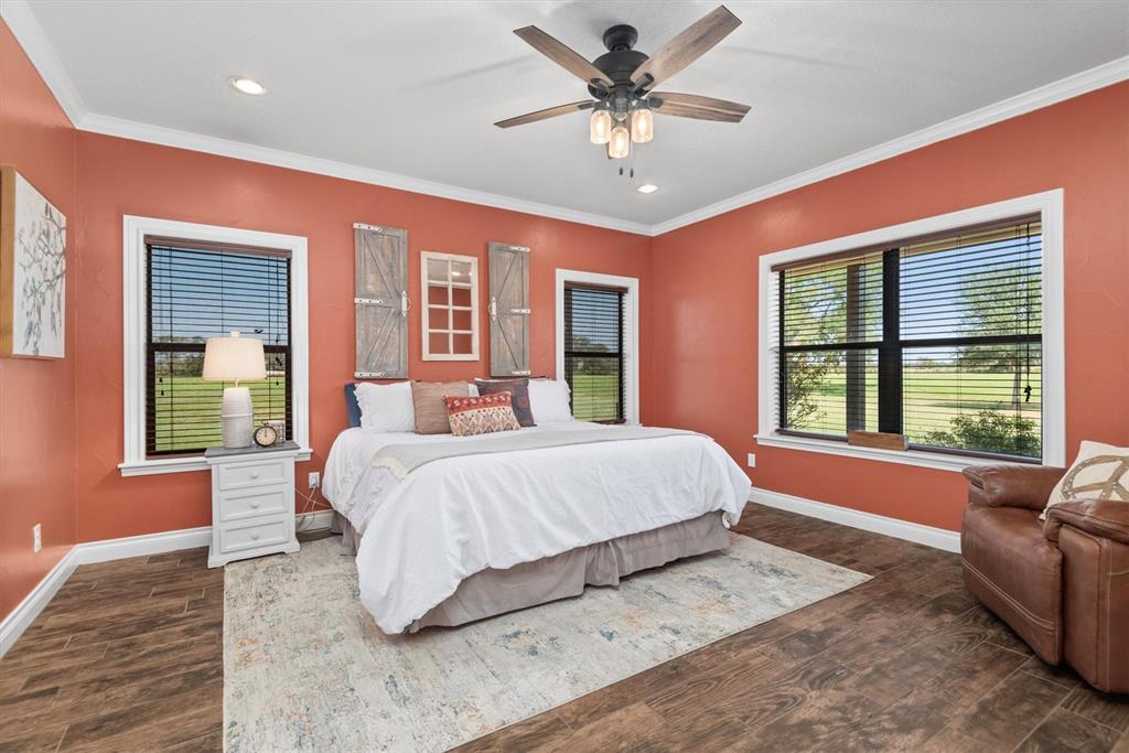 3759 Cr 126 Road Bedias, TX 77831 - Photo 13 of 38 a spacious bedroom with a large bed and a window