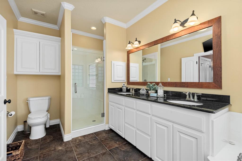 3759 Cr 126 Road Bedias, TX 77831 - Photo 14 of 38 a bathroom with a toilet sink and mirror