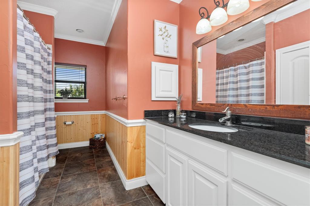 3759 Cr 126 Road Bedias, TX 77831 - Photo 17 of 38 a bathroom with a sink and a bathtub