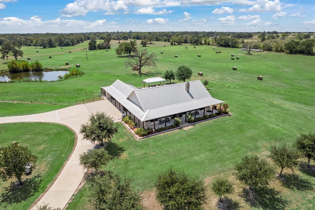 3759 Cr 126 Road Bedias, TX 77831 - Photo 2 of 38 a view of a garden with an outdoor space and seating area