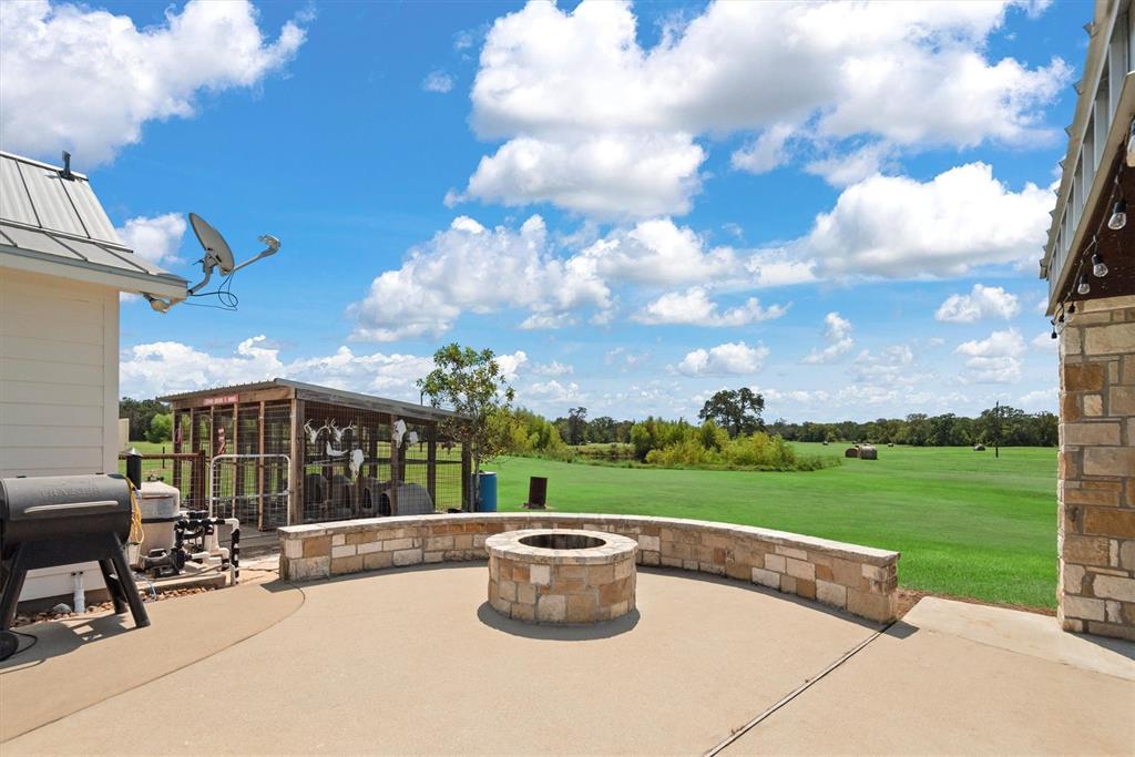 3759 Cr 126 Road Bedias, TX 77831 - Photo 21 of 38 a view of a patio with a table and chairs