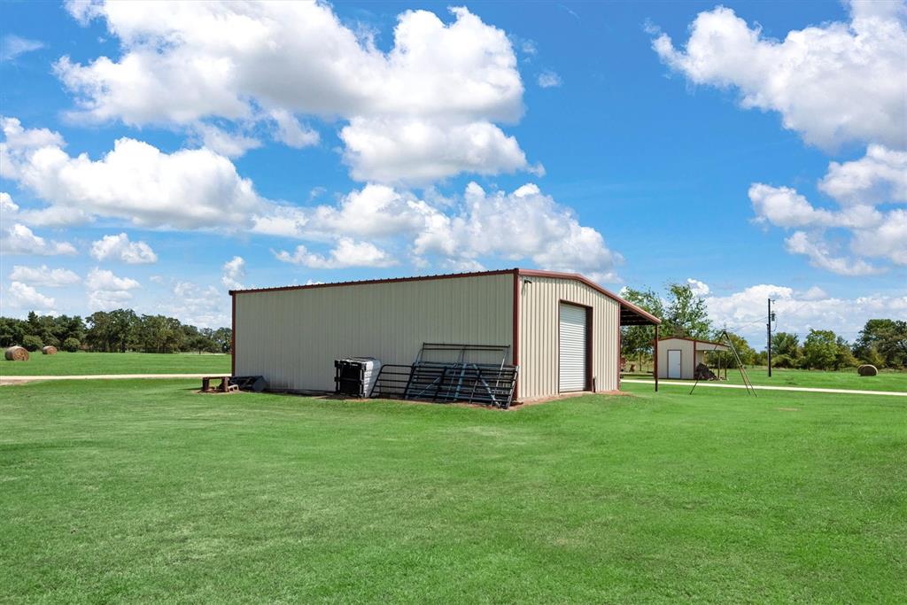 3759 Cr 126 Road Bedias, TX 77831 - Photo 23 of 38 a view of a house with a yard