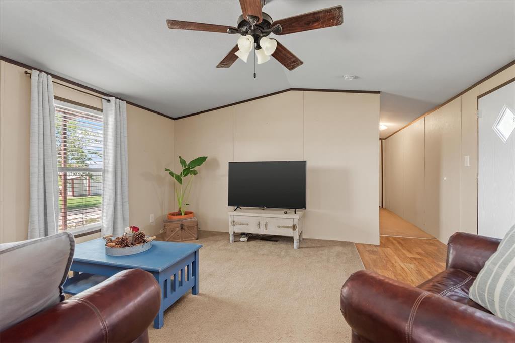 3759 Cr 126 Road Bedias, TX 77831 - Photo 26 of 38 a living room with furniture and a flat screen tv