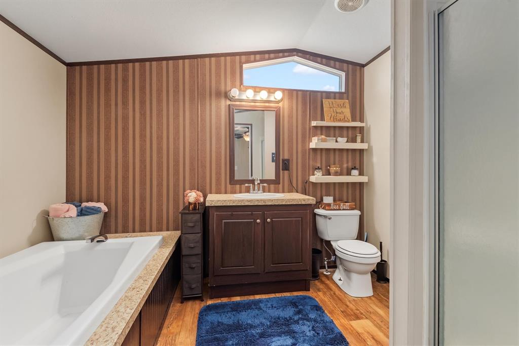 3759 Cr 126 Road Bedias, TX 77831 - Photo 30 of 38 a spacious bathroom with a sink toilet and shower