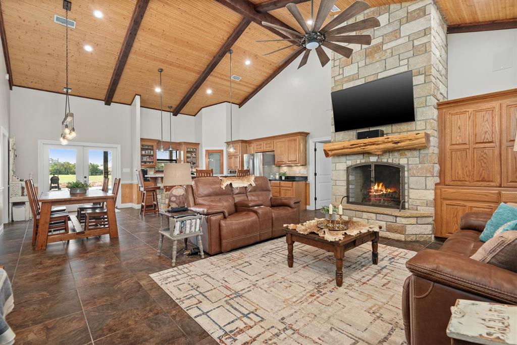 3759 Cr 126 Road Bedias, TX 77831 - Photo 7 of 38 a living room with furniture a flat screen tv and kitchen view