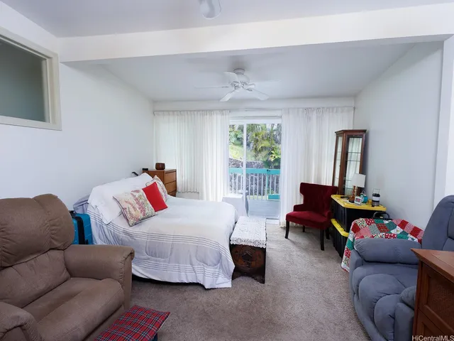 a bedroom with furniture and a window