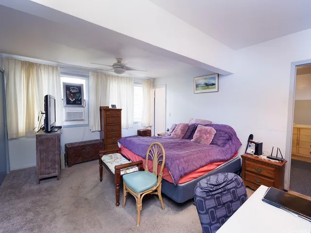 a bed room with a bed and furniture