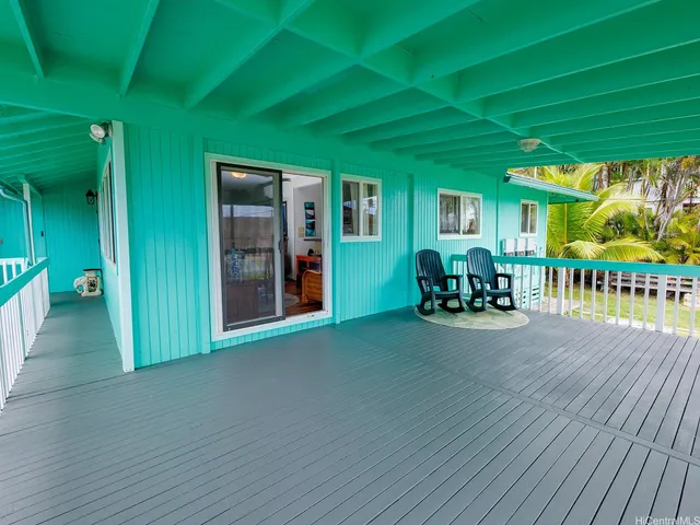 a view of a porch with wooden floor and outdoor space