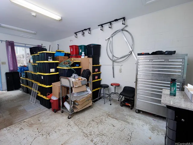 a bedroom with bed and a chandelier