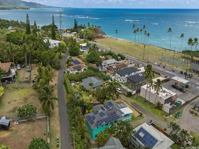 an aerial view of residential houses with outdoor space