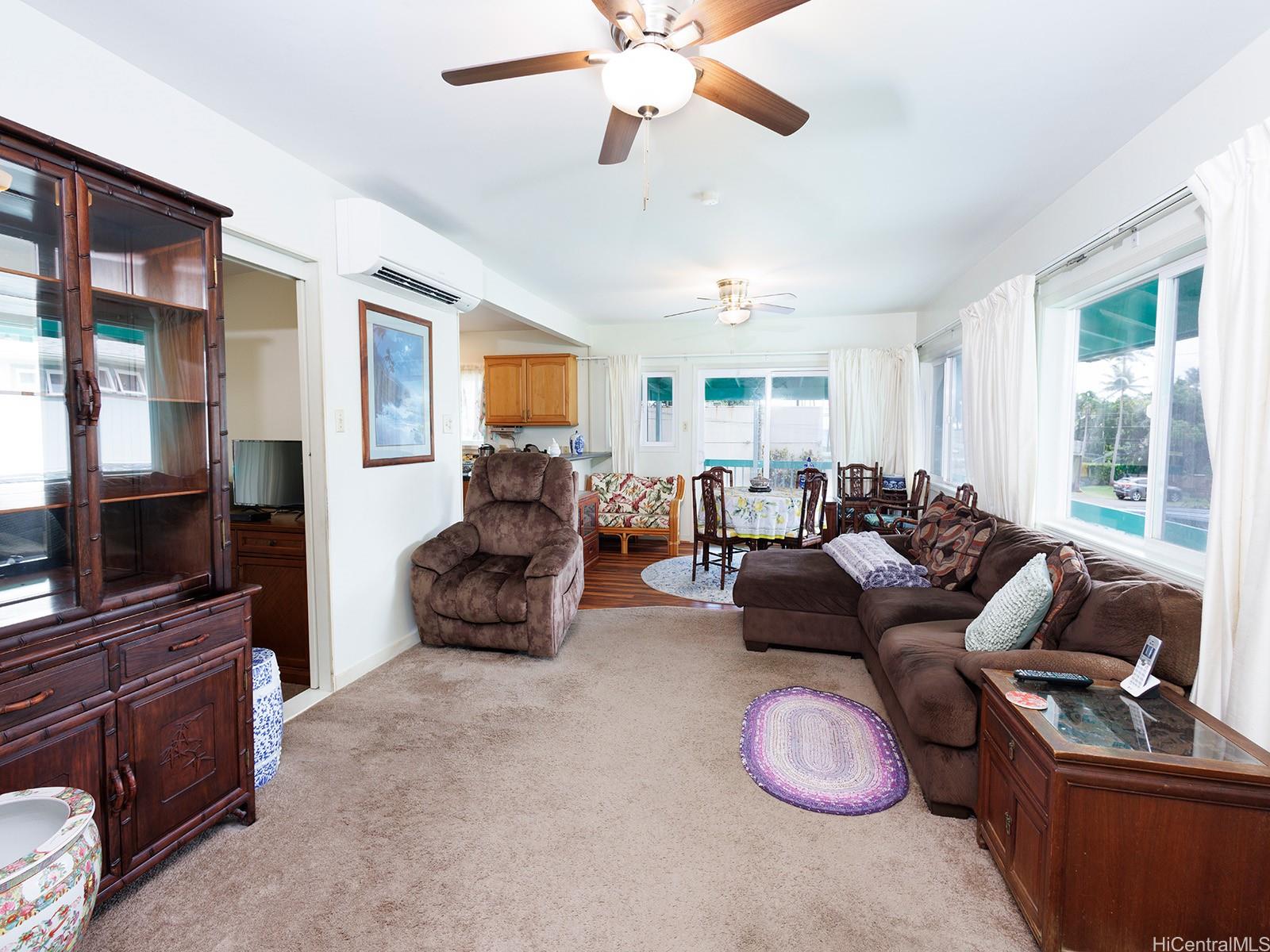 51-450 Kekio Road Kaaawa, HI 96730 - Photo 9 of 25 a living room with furniture and a flat screen tv
