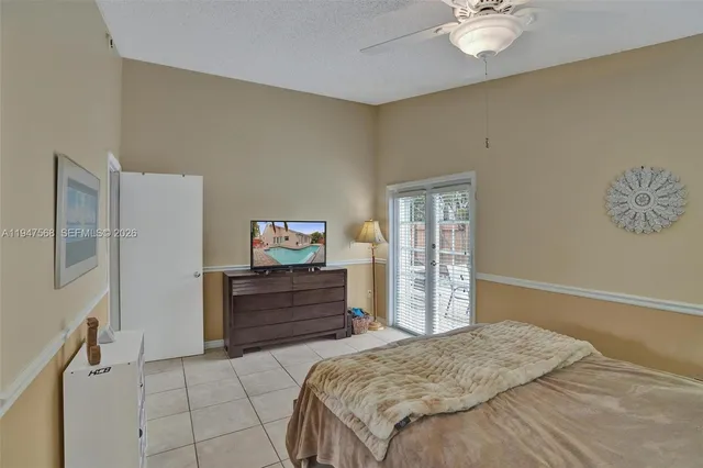 a spacious bathroom with a mirror sink and shower