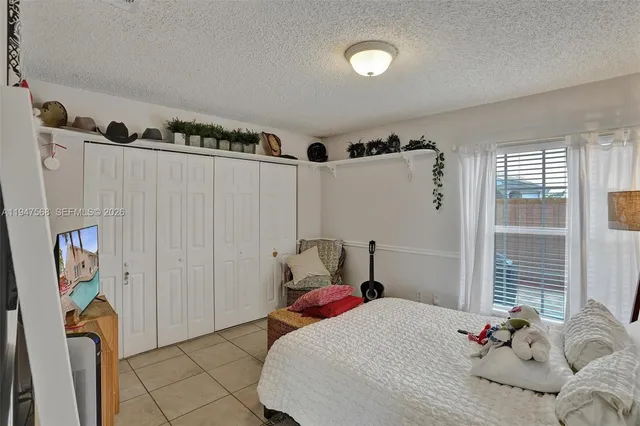 a bedroom with a bed and a table in it