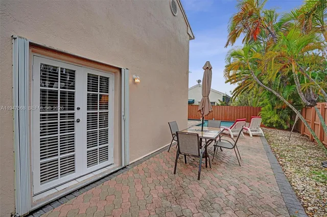 a view of a house with a backyard