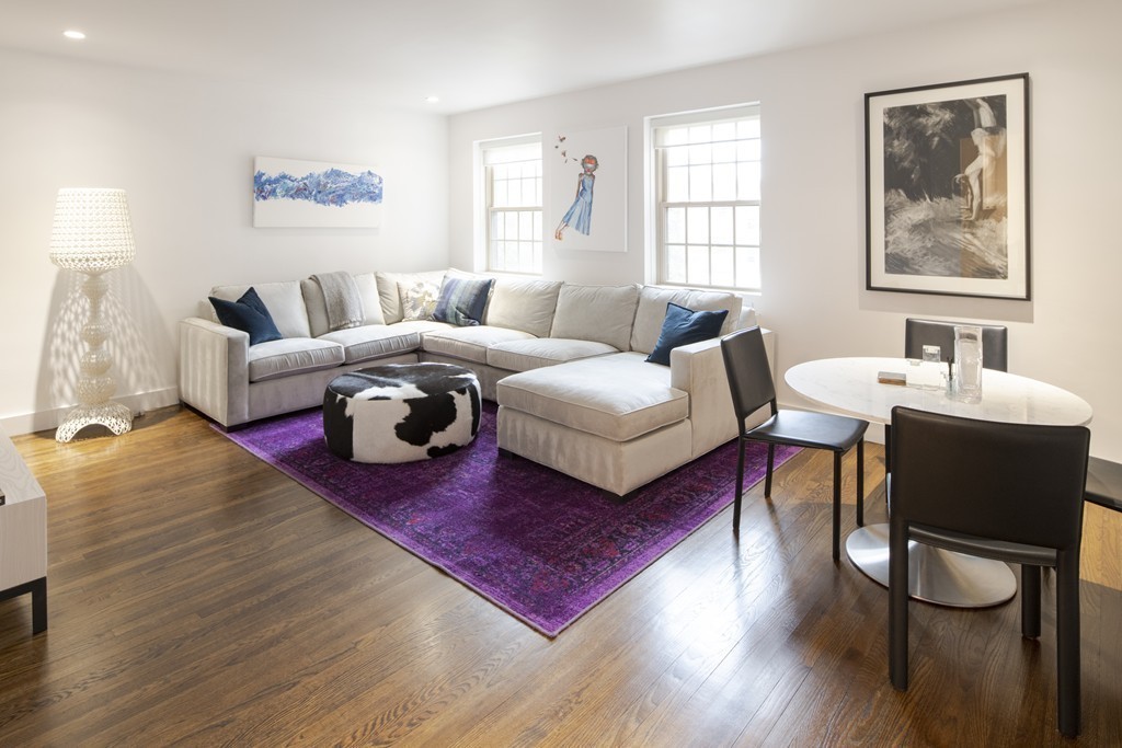 1490 Beacon Street, Unit 4 Brookline, MA 02446 - Photo 11 of 26 a living room with furniture and wooden floor