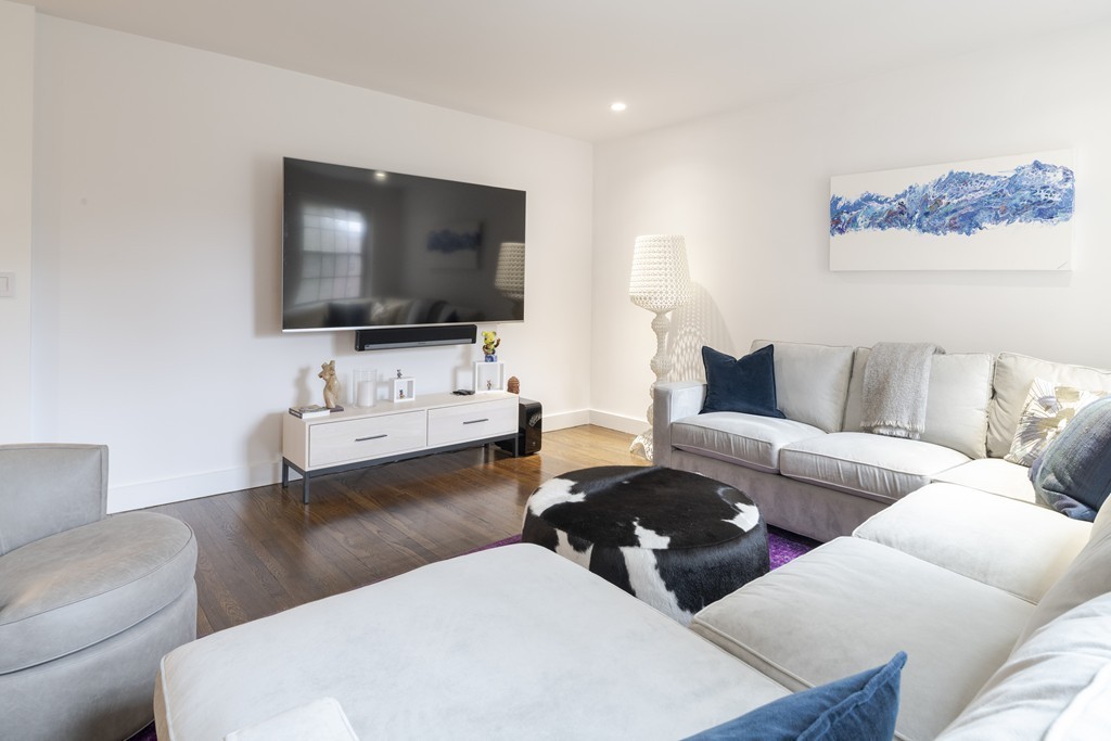 1490 Beacon Street, Unit 4 Brookline, MA 02446 - Photo 13 of 26 a living room with furniture and a flat screen tv
