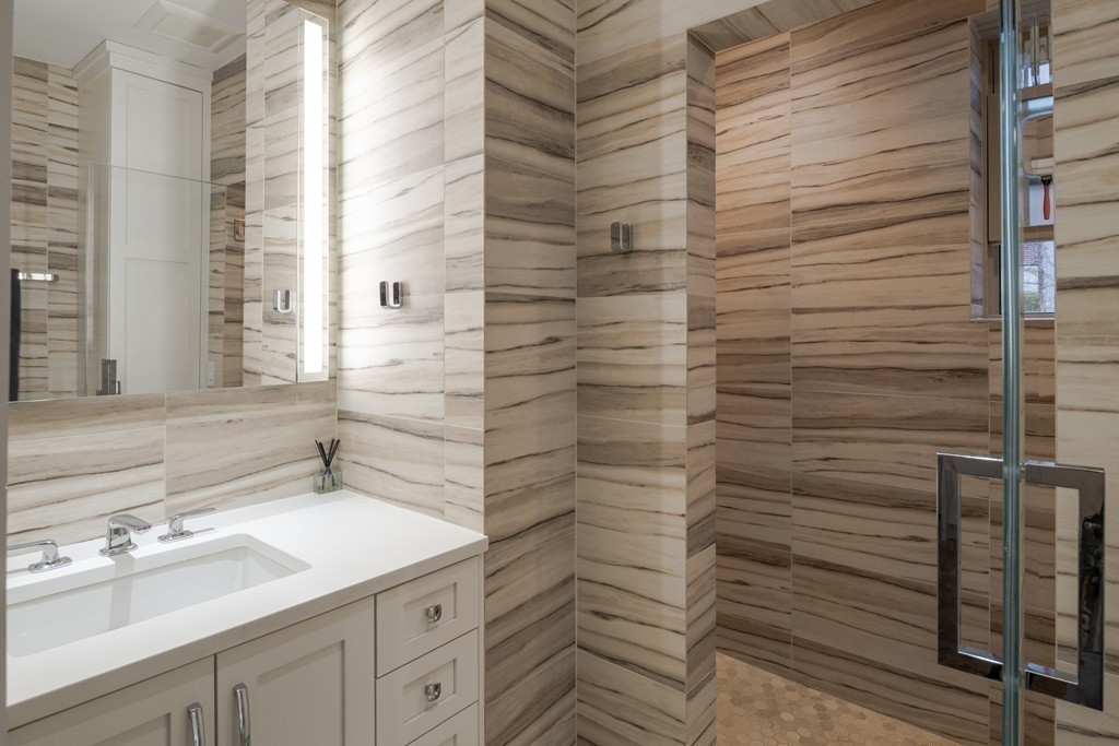 1490 Beacon Street, Unit 4 Brookline, MA 02446 - Photo 15 of 26 a bathroom with a shower and a sink