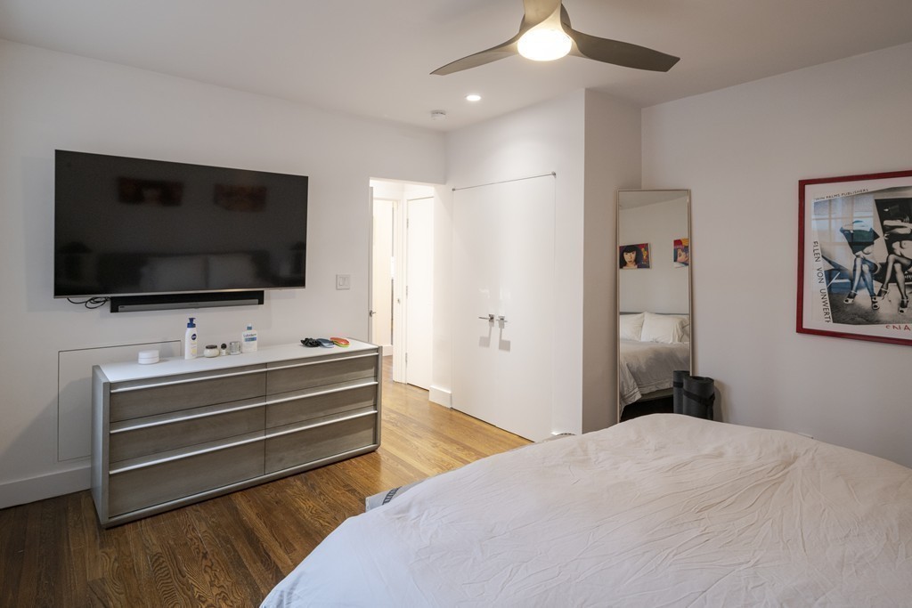 1490 Beacon Street, Unit 4 Brookline, MA 02446 - Photo 20 of 26 a bedroom with bed and flat screen tv