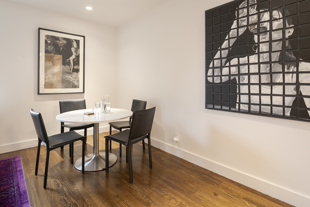 1490 Beacon Street, Unit 4 Brookline, MA 02446 - Photo 10 of 26 a view of a dining room with furniture and wooden floor
