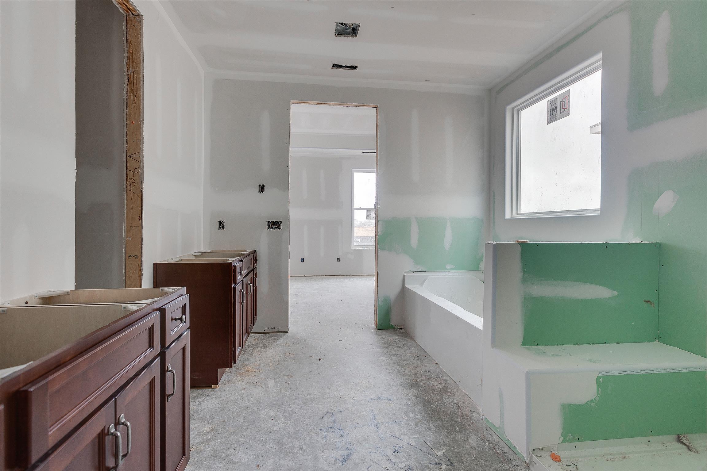 454 Rangeland Road Spring Hill, TN 37174 - Photo 12 of 14 Large master bath with tile wall shower and raised vanities.