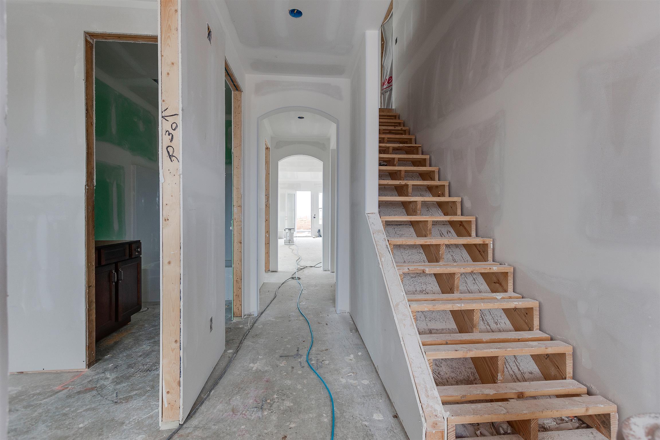 454 Rangeland Road Spring Hill, TN 37174 - Photo 4 of 14 Beautiful hardwood staircase included along with archways and all 8 ft doors on main floor