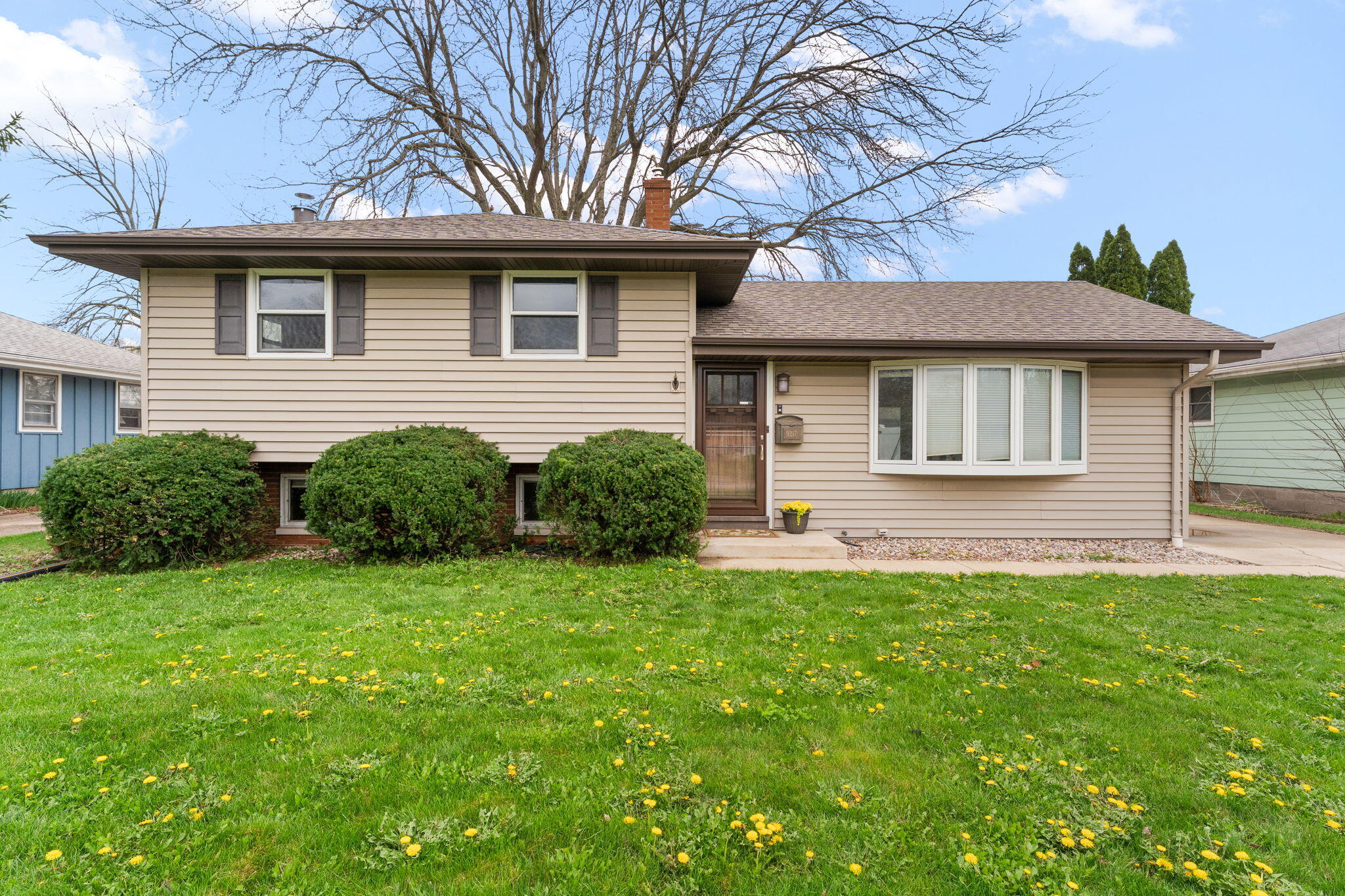 9217 Grace Street Highland, IN 46322 - Photo 1 of 29 a front view of a house with a garden