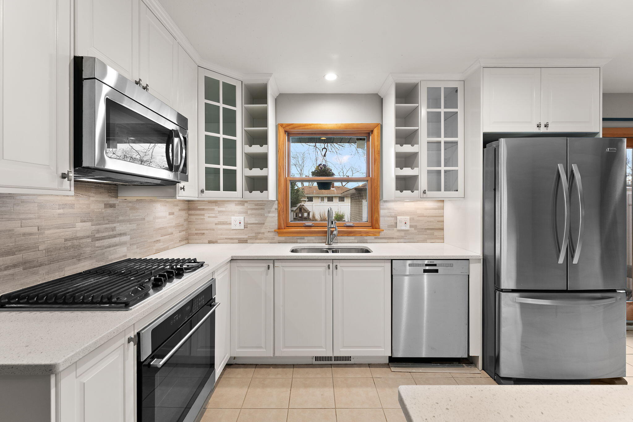 9217 Grace Street Highland, IN 46322 - Photo 11 of 29 a kitchen with a refrigerator sink and microwave