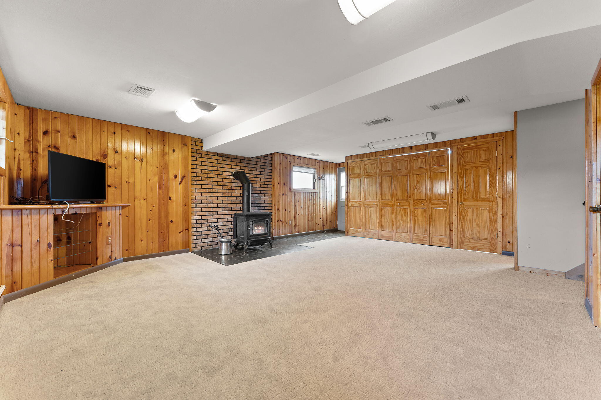 9217 Grace Street Highland, IN 46322 - Photo 20 of 29 a view of a livingroom with a flat screen tv and floor to ceiling window