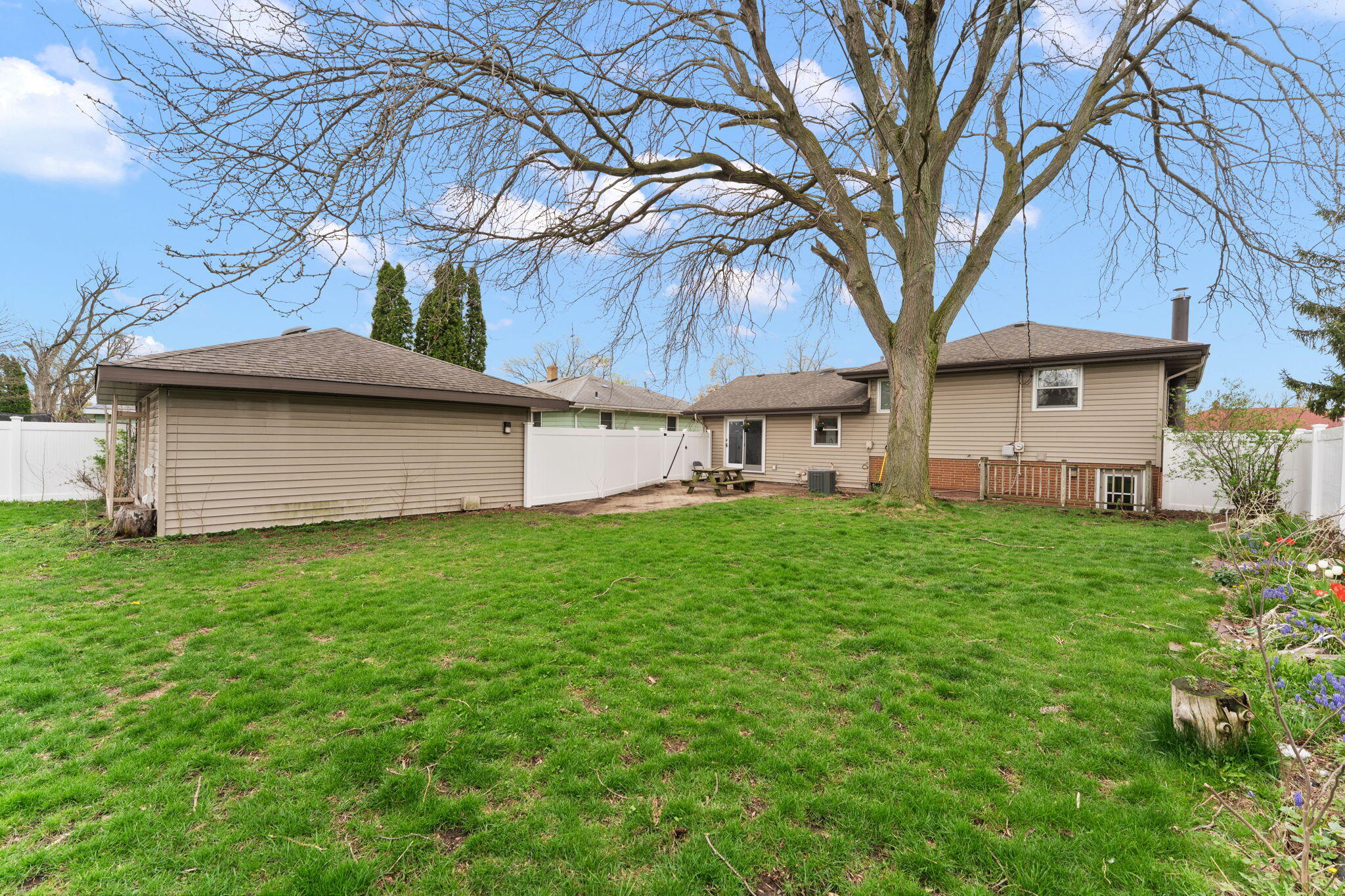 9217 Grace Street Highland, IN 46322 - Photo 26 of 29 a view of a house with a backyard