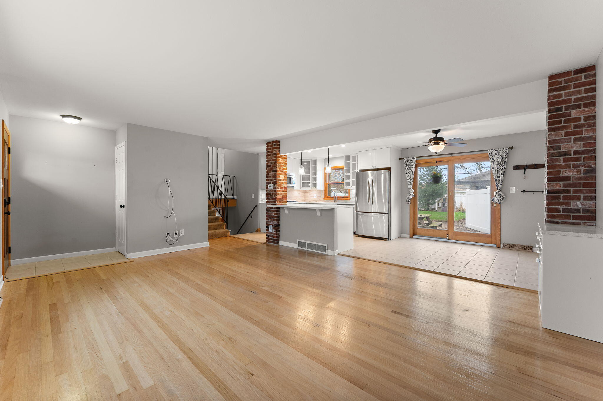 9217 Grace Street Highland, IN 46322 - Photo 5 of 29 a view of an empty room with wooden floor and a window