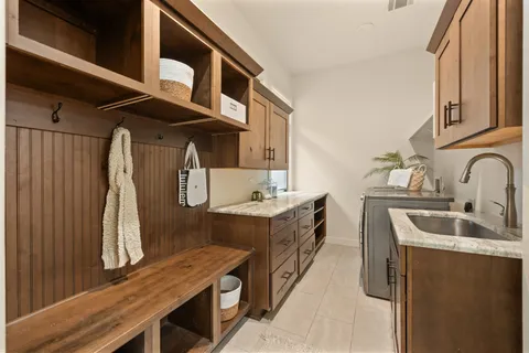 a kitchen with stainless steel appliances a refrigerator sink and stove