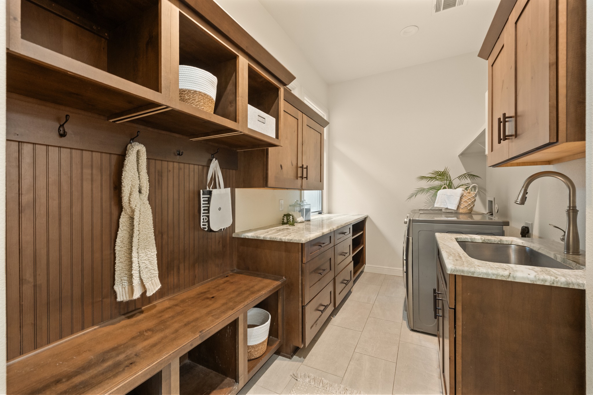 3907 Bailey Lane Austin, TX 78756 - Photo 14 of 40 The combined laundry and mud area provide a convenient space to kick off your shoes, hang up bags and jackets, and throw the dirty laundry straight into the machines