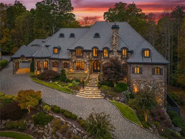 a front view of house with yard and green space