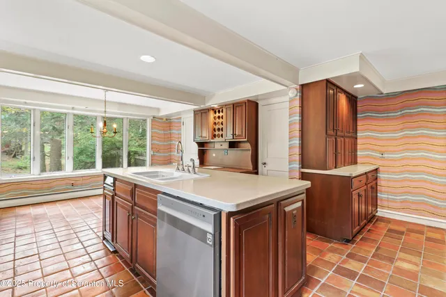 a view of a bedroom with furniture and a window