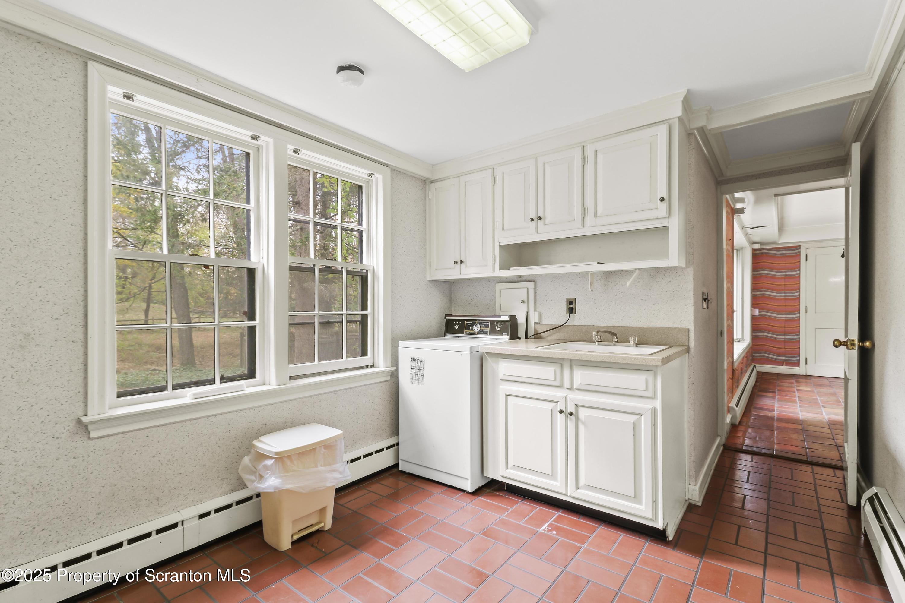 28 Church Hill Road Dalton, PA 18414 - Photo 13 of 63 a kitchen with a stove a sink and a refrigerator