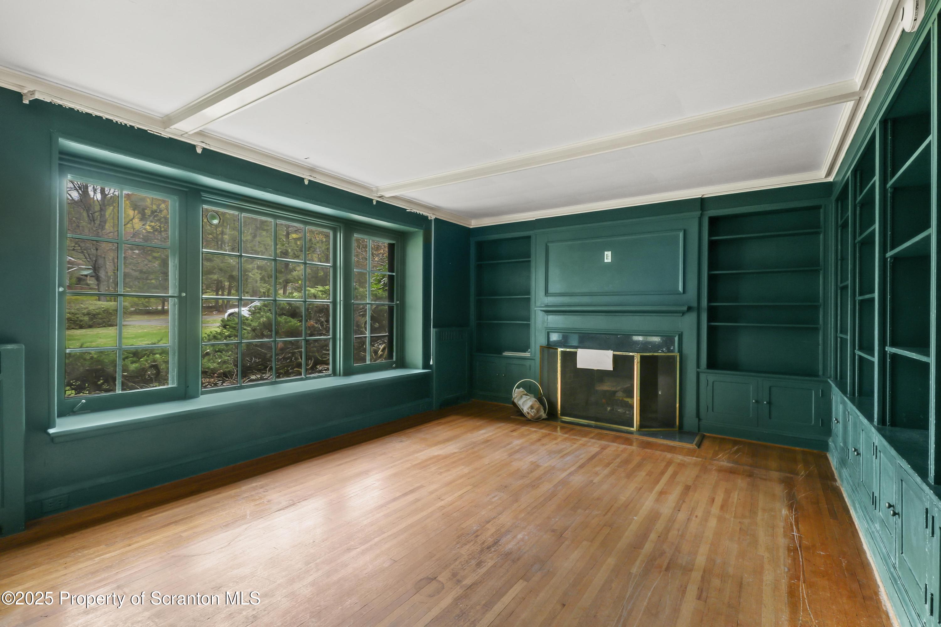 28 Church Hill Road Dalton, PA 18414 - Photo 20 of 63 a view of an empty room with a fireplace and a window