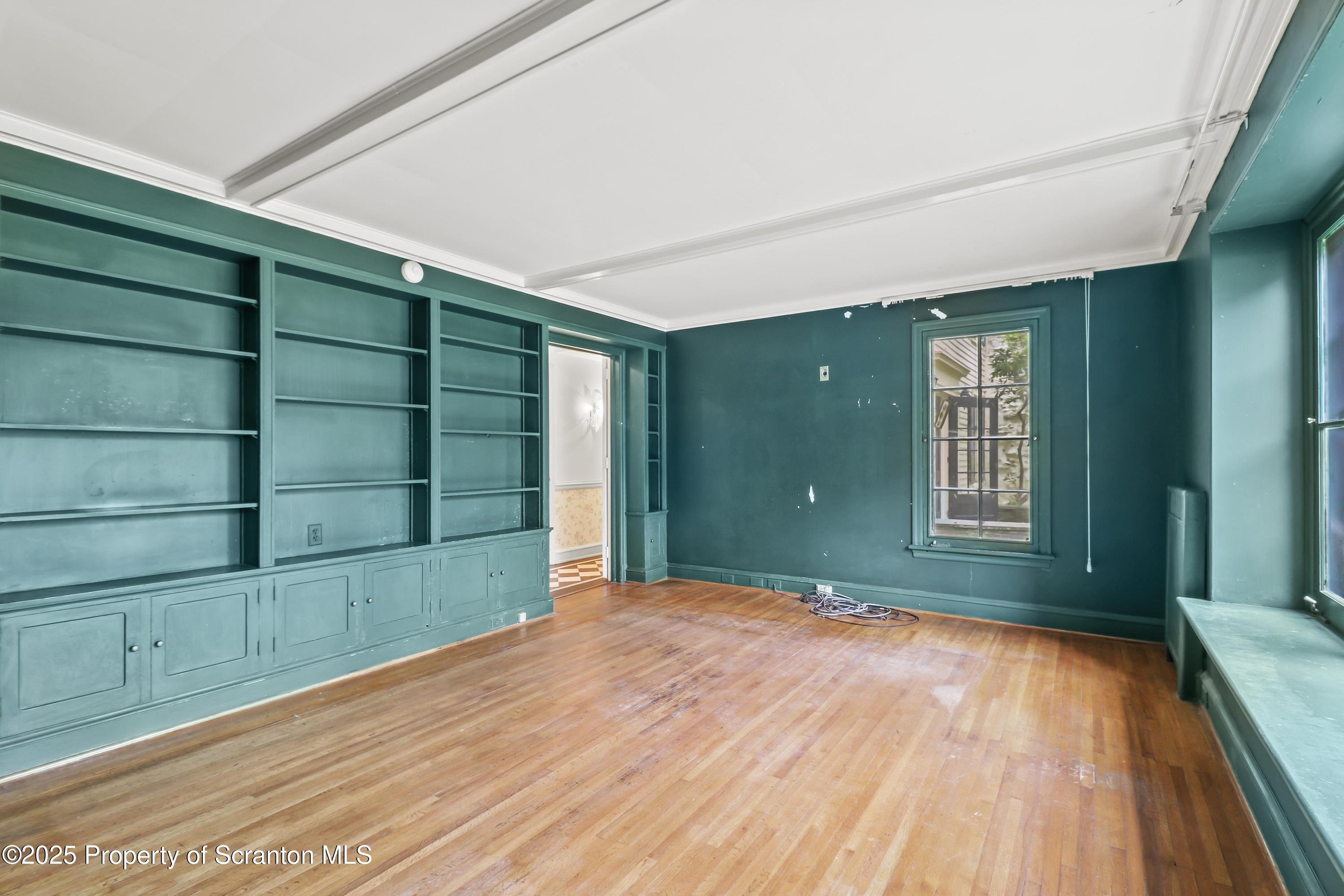28 Church Hill Road Dalton, PA 18414 - Photo 21 of 63 a view of a room with a large window and wooden floor