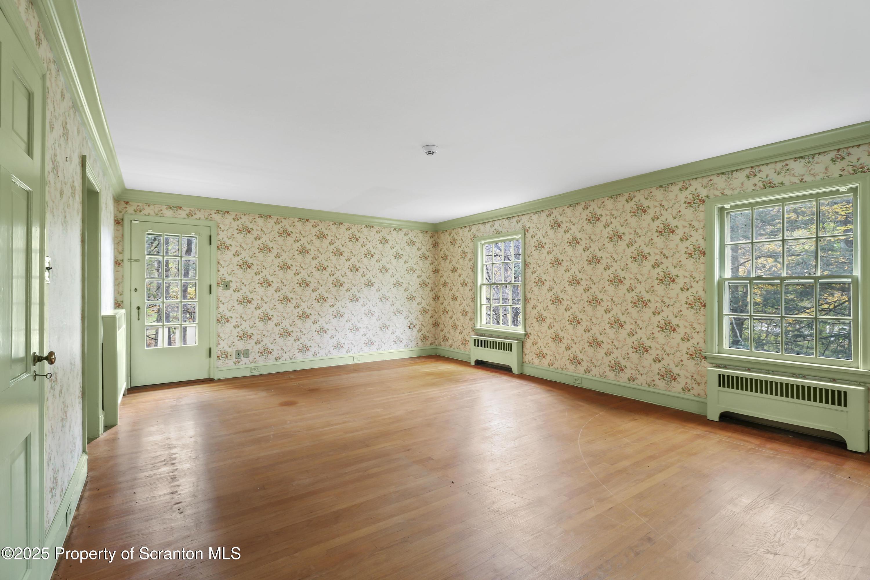 28 Church Hill Road Dalton, PA 18414 - Photo 24 of 63 a view of an empty room with a window and wooden floor