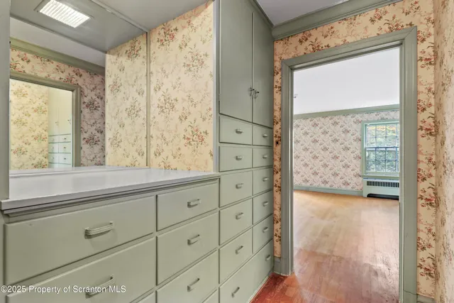 a bathroom with a sink and a mirror