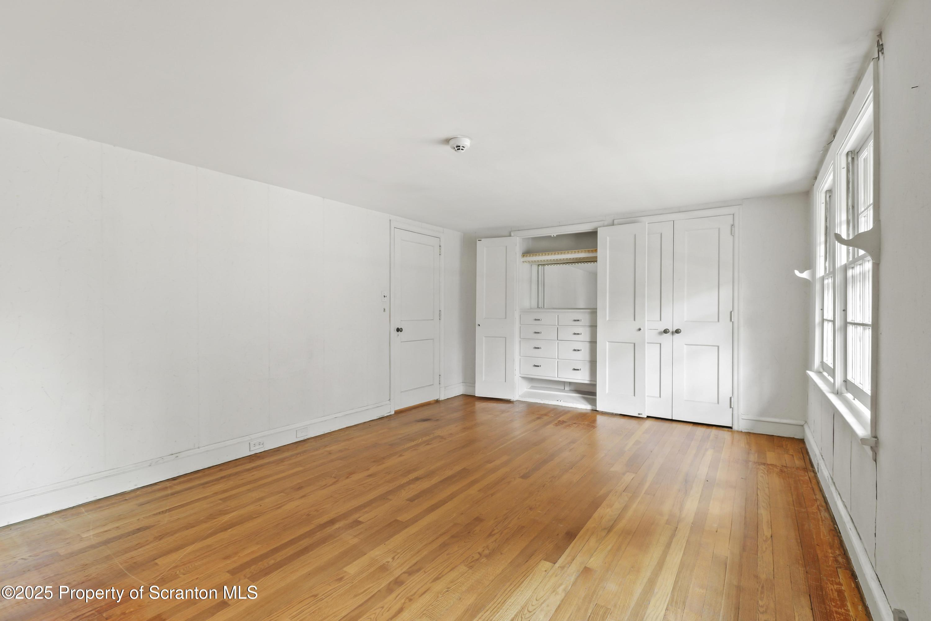 28 Church Hill Road Dalton, PA 18414 - Photo 32 of 63 a view of an empty room with wooden floor