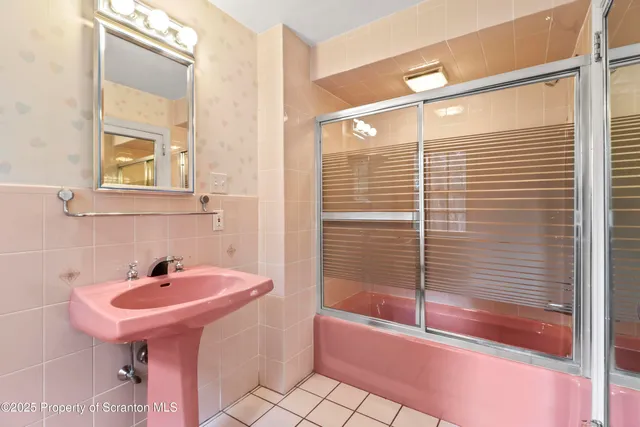 a bathroom with a bathtub and a sink