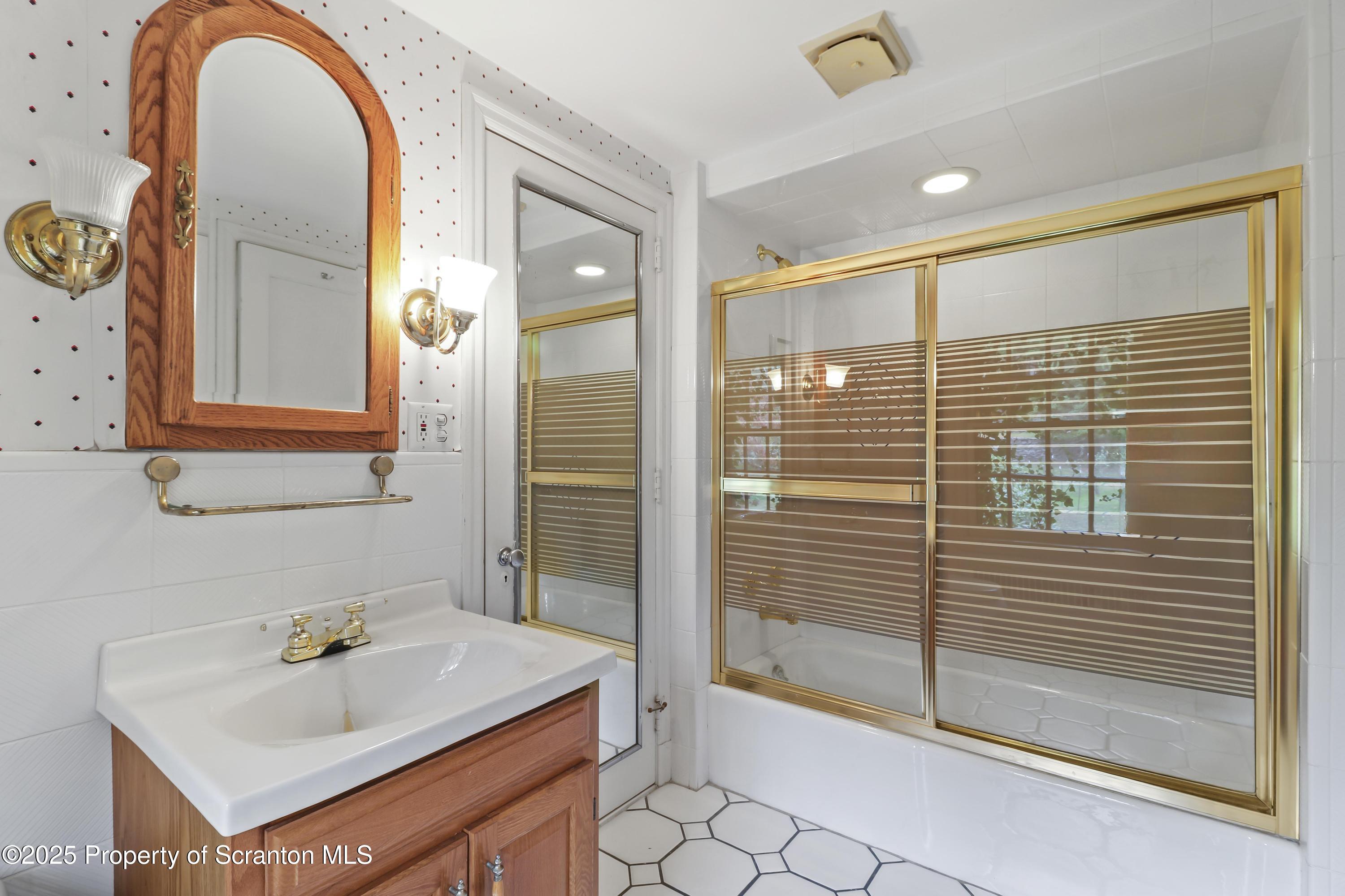 28 Church Hill Road Dalton, PA 18414 - Photo 36 of 63 a bathroom with a sink and a mirror