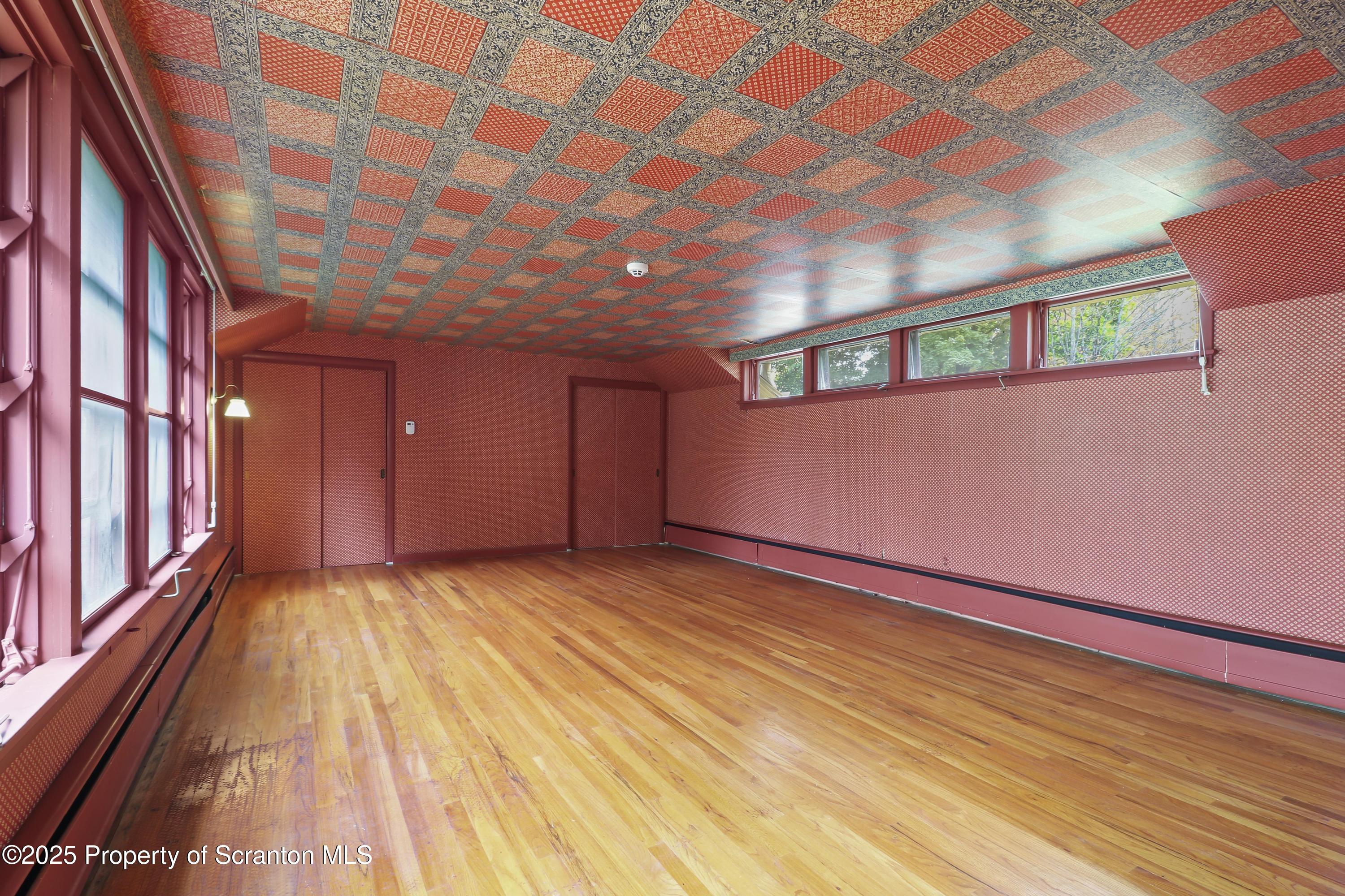 28 Church Hill Road Dalton, PA 18414 - Photo 41 of 63 a view of an empty room with wooden floor and a window