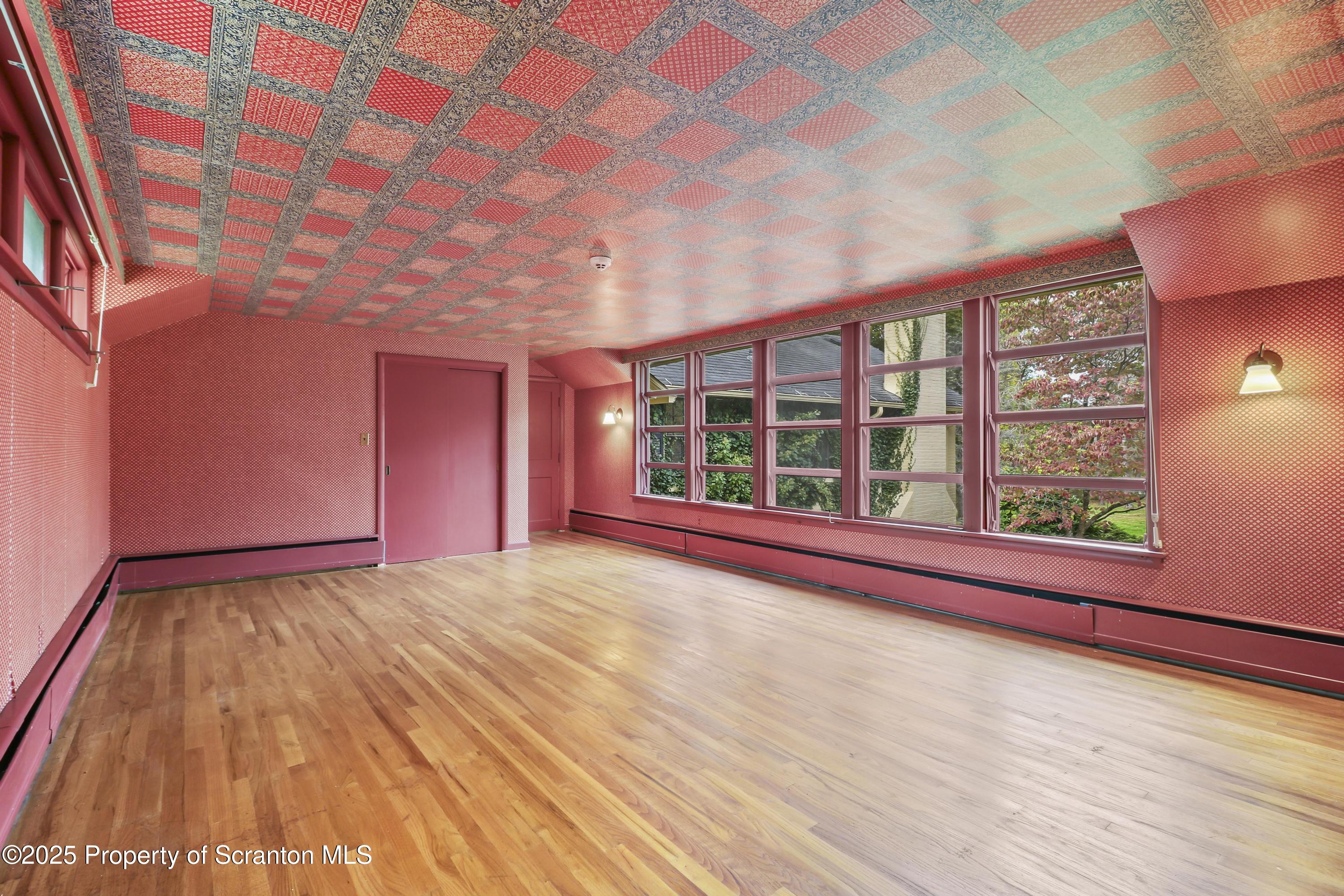 28 Church Hill Road Dalton, PA 18414 - Photo 42 of 63 a view of an empty room with a window and wooden floor