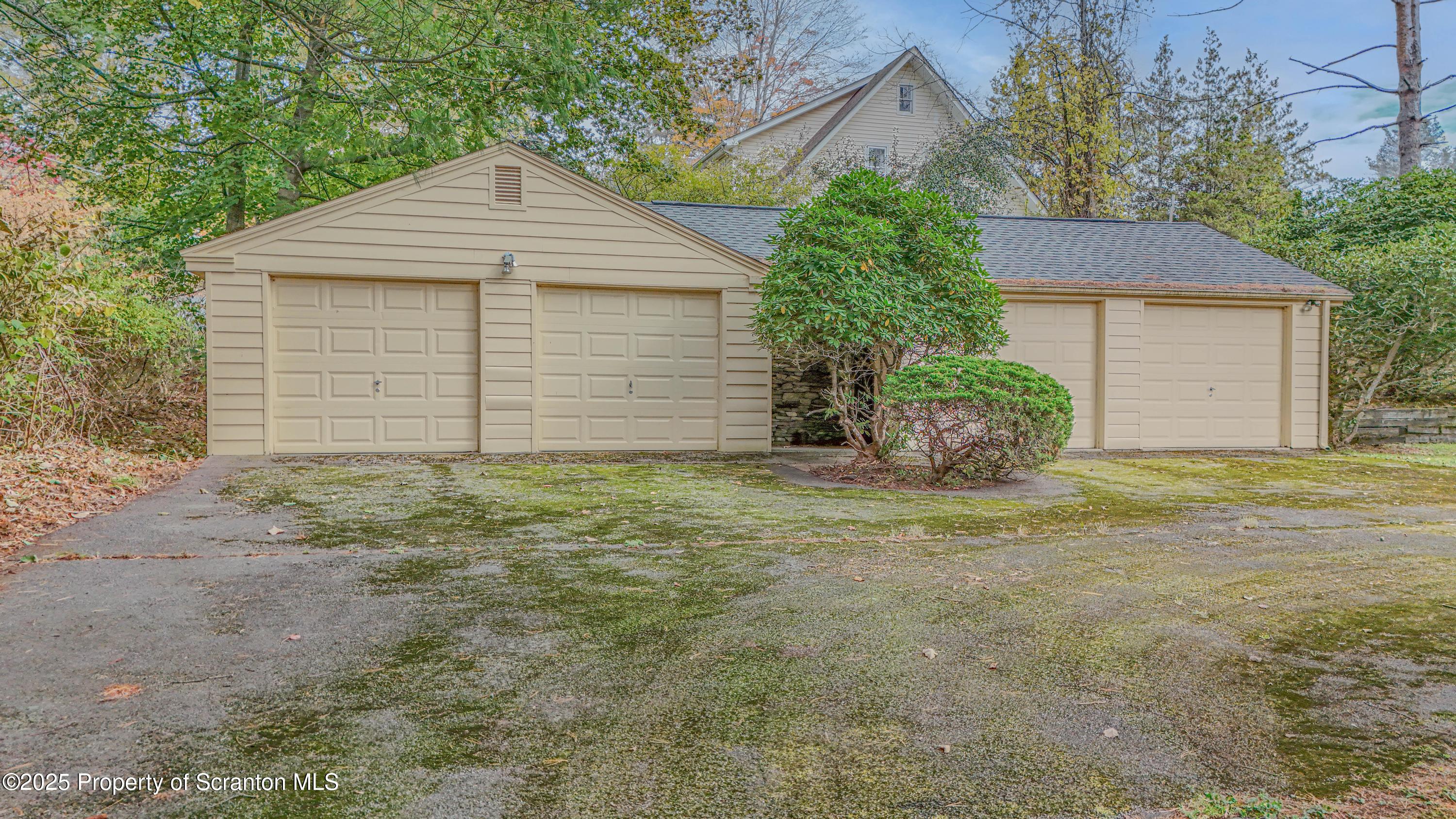 28 Church Hill Road Dalton, PA 18414 - Photo 60 of 63 a front view of a house with a yard and garage