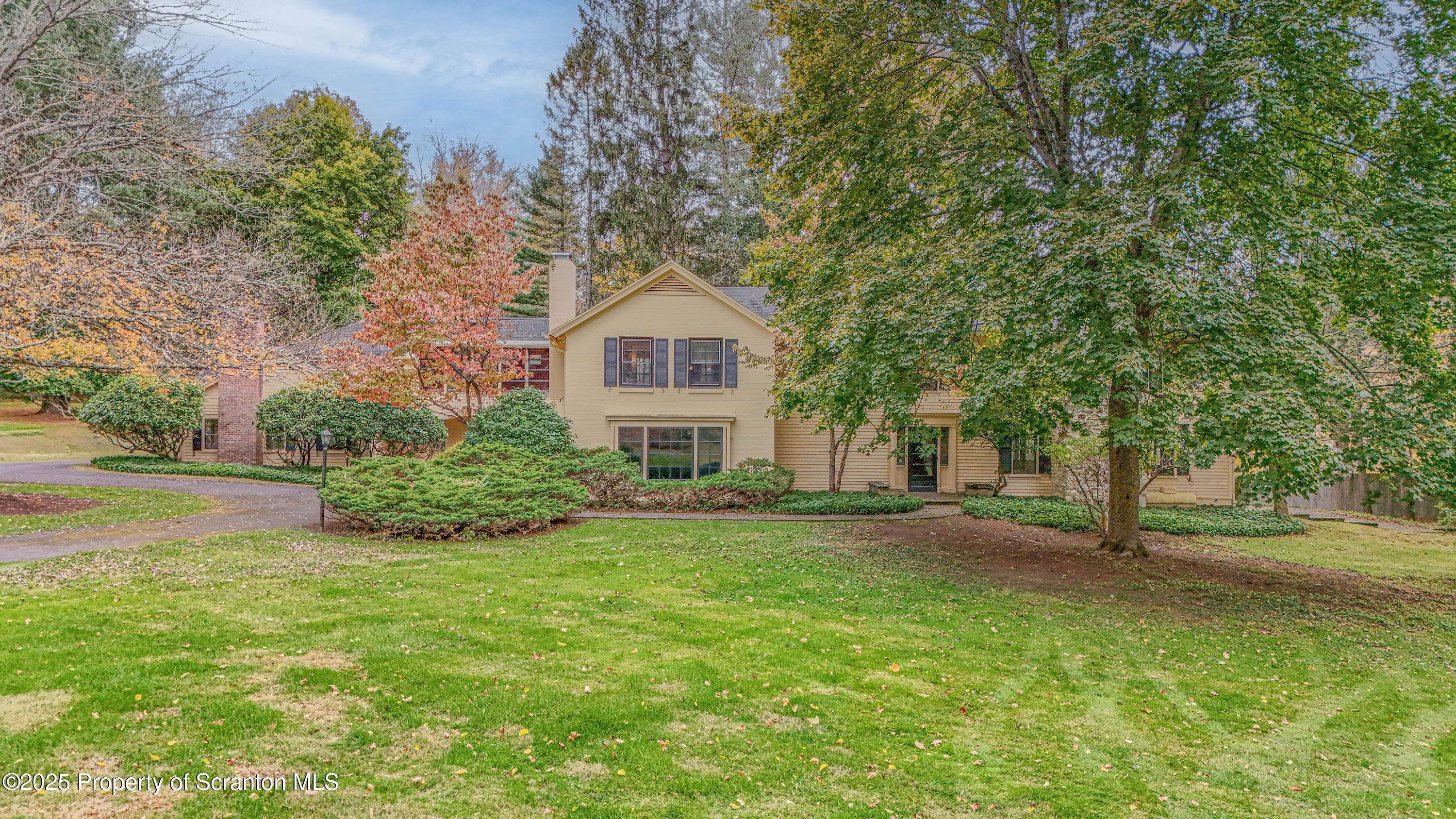 28 Church Hill Road Dalton, PA 18414 - Photo 63 of 63 a front view of a house with a yard and trees