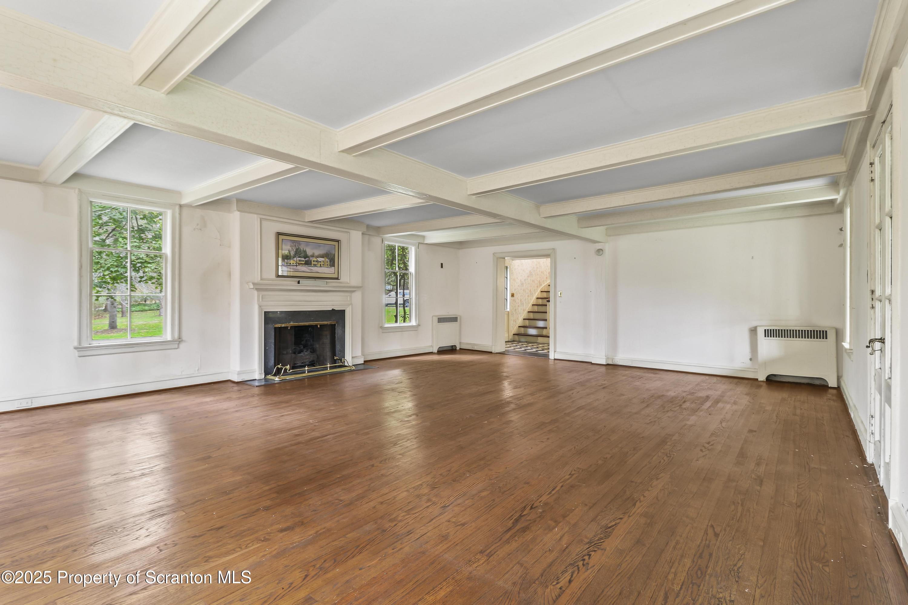 28 Church Hill Road Dalton, PA 18414 - Photo 7 of 63 an empty room with windows and fireplace