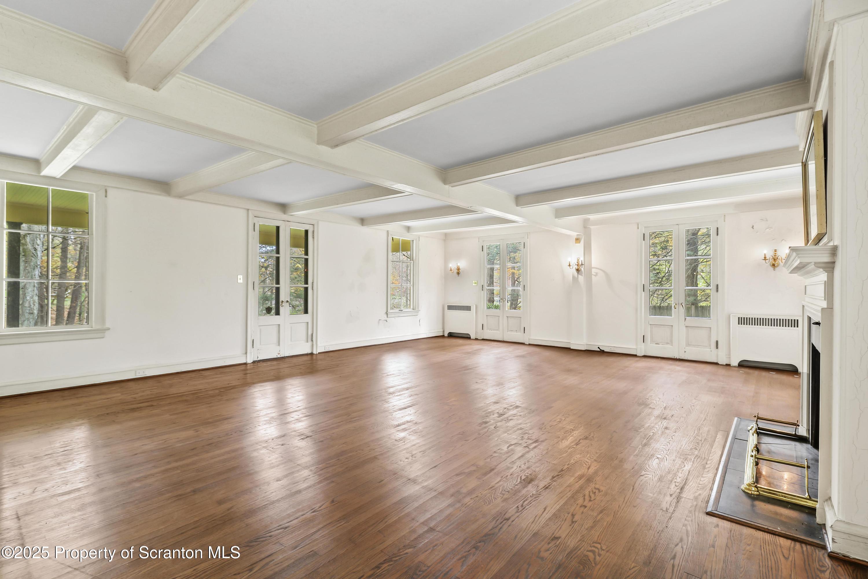 28 Church Hill Road Dalton, PA 18414 - Photo 8 of 63 an empty room with wooden floor and windows
