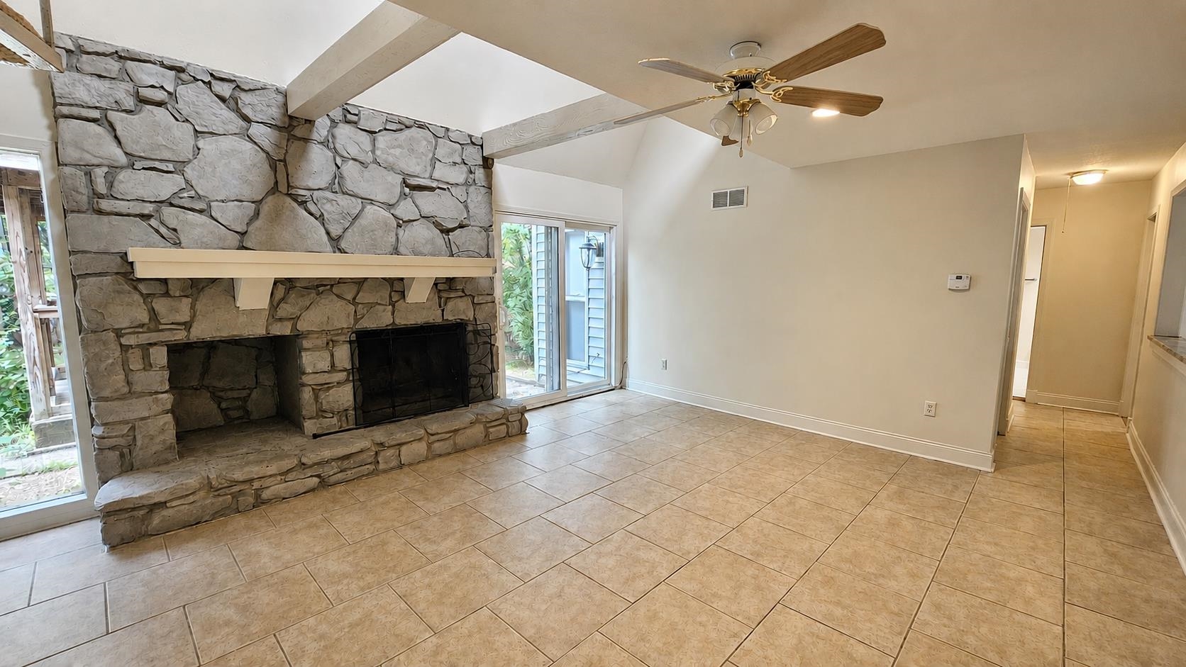 89 Ericson Road Memphis, TN 38018 - Photo 16 of 36 an empty room with windows and fireplace